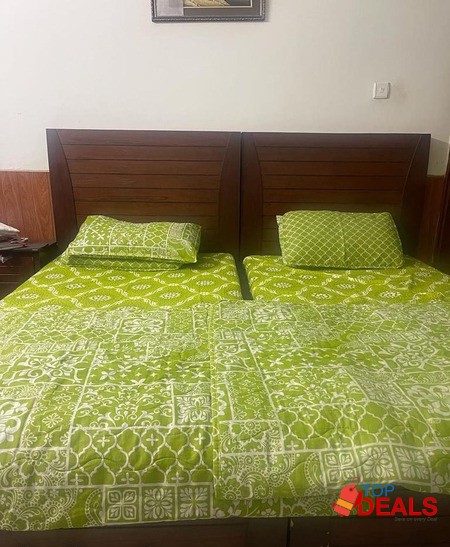 Single beds with a side table image 1