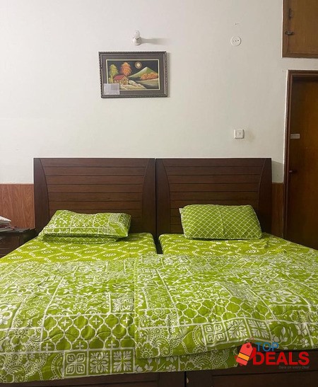 Single beds with a side table image 2