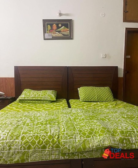 Single beds with a side table image 3